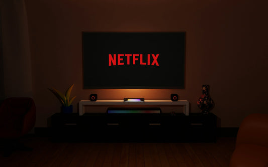 Open box TV setup in a modern Canadian living room with Netflix on screen, LED speakers, and soundbar for a complete home entertainment experience.