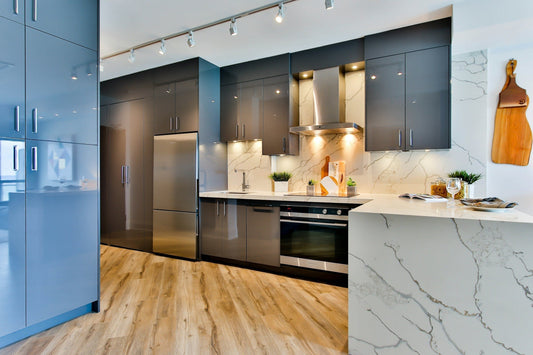 A sleek, modern Canadian kitchen featuring a bottom freezer fridge and stainless steel range, perfect for small spaces or condo living.