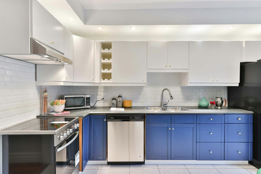 A stylish kitchen setup featuring stainless steel appliances and two-tone cabinetry. A perfect example of a coordinated kitchen appliance package in a Canadian home.